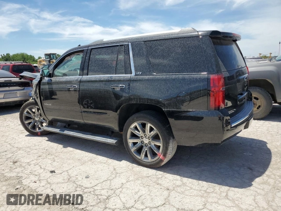 2015 Chevrolet Tahoe LTZ z VIN 1GNSKCKC8FR506151, wystawiony jako Copart lot #59948174 z przebiegiem Nie podano mil oraz Szkoda całkowita • Salvage title. Historia ofert i sprzedaży dostępna na DreamBid. Obrazek 2.