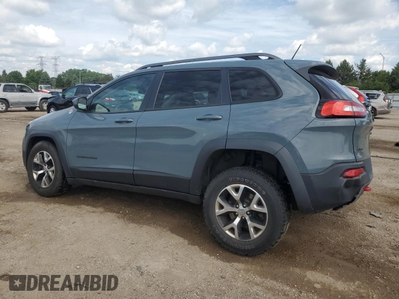 2015 Jeep Cherokee Trailhawk with VIN 1C4PJMBB1FW630715, listed as a Copart auction lot 58559675 with 58,302 mi miles and Salvage title. Bid and sale history available at DreamBid. Image 2.