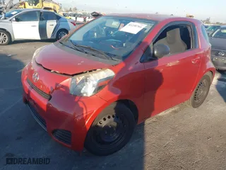 2013 Scion iQ with VIN JTNJJXB02DJ022231, listed as a IAAI auction lot 41238766 with 98,300 mi miles. Bid and sale history available at carsss.com. Image 2.
