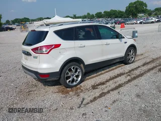 2015 Ford Escape Titanium with VIN 1FMCU0JXXFUA07175, listed as a IAAI auction lot 42447067 with 94,893 mi miles and . Bid and sale history available at DreamBid. Image 4.