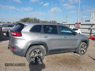 2015 Jeep Cherokee Trailhawk with VIN 1C4PJMBS3FW662307, listed as a IAAI auction lot 41778932 with 64,569 mi miles. Bid and sale history available at carsss.com. Image 13.