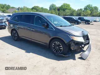 2012 Honda Odyssey EX-L with VIN 5FNRL5H61CB034751, listed as a IAAI auction lot 42372469 with 233,312 mi miles and . Bid and sale history available at DreamBid. Image 1.