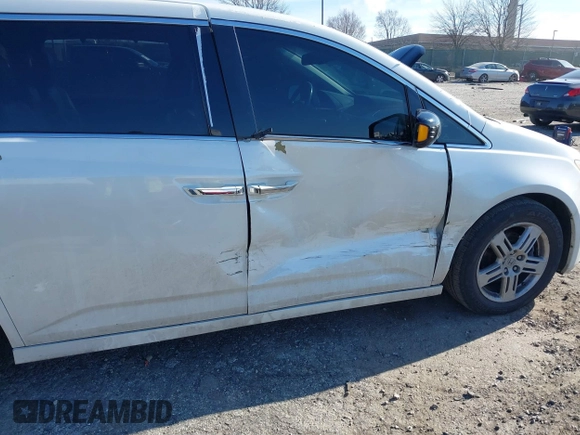 2012 Honda Odyssey Touring with VIN 5FNRL5H96CB010696, listed as a IAAI auction lot 41605868 with 109,411 mi miles and . Bid and sale history available at carsss.com. Image 6.