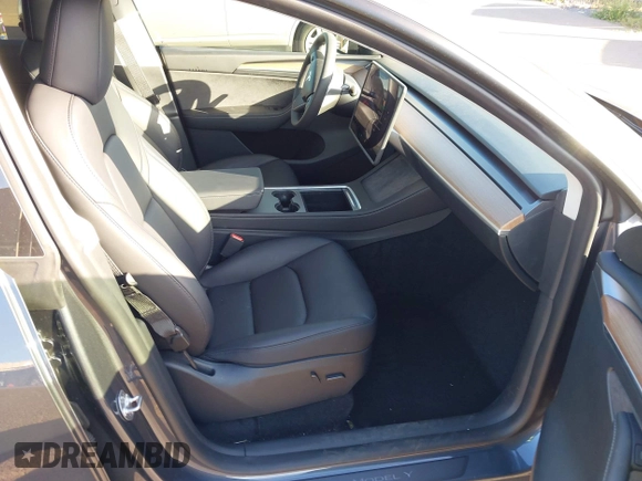 2023 Tesla Model Y Long Range with VIN 7SAYGDEE0PF928836, listed as a IAAI auction lot 41538742 with 9,630 mi miles and . Bid and sale history available at DreamBid. Image 5.