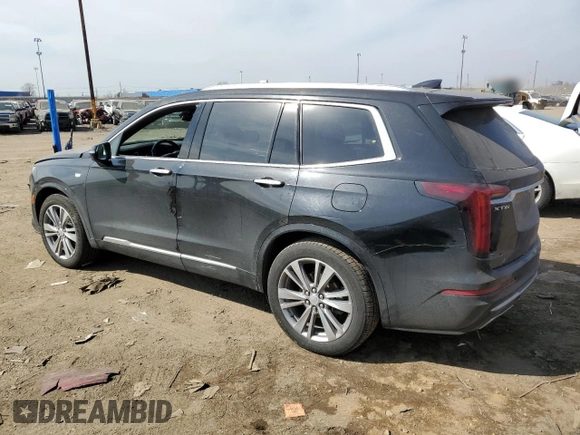 2023 Cadillac XT6 FWD Premium Luxury with VIN 1GYKPCRS4PZ103061, listed as a Copart auction lot 49300205 with 72,131 mi miles and Salvage title. Bid and sale history available at DreamBid. Image 2.