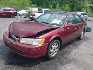 2000 Toyota Camry CE z VIN JT2BG22K3Y0521541, wystawiony jako IAAI lot #42074772 z przebiegiem 144 587 mil mil oraz . Historia ofert i sprzedaży dostępna na DreamBid. Obrazek 20.