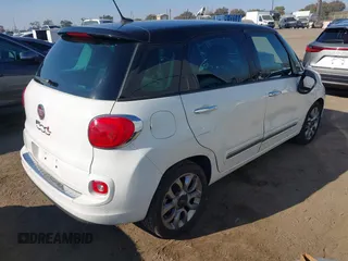 2014 FIAT 500L Lounge with VIN ZFBCFACH9EZ004041, listed as a IAAI auction lot 41366234 with 106,769 mi miles and . Bid and sale history available at DreamBid. Image 4.