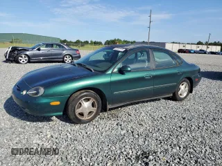 1999 Ford Taurus SE with VIN 1FAFP53U2XG184723, listed as a Copart auction lot 60787115 with 128,277 mi miles and Salvage title. Bid and sale history available at DreamBid. Image 1.