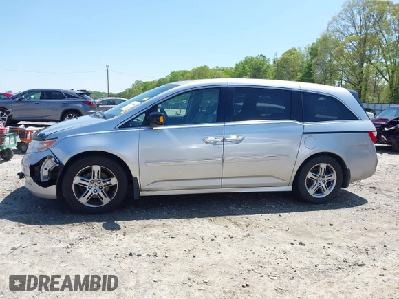 2012 Honda Odyssey Touring with VIN 5FNRL5H96CB043939, listed as a IAAI auction lot 41983643 with 202,535 mi miles. Bid and sale history available at carsss.com. Image 15.