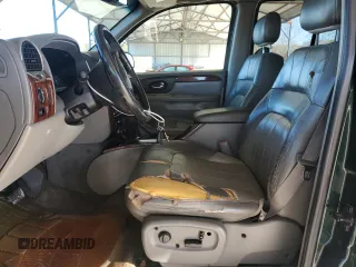2004 GMC Envoy SLT z VIN 1GKDS13S942127830, wystawiony jako Copart lot #87165024 z przebiegiem 172 592 mil mil oraz Szkoda całkowita • Salvage title. Historia ofert i sprzedaży dostępna na DreamBid. Obrazek 7.