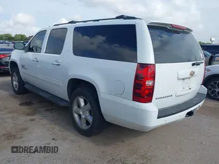 2011 Chevrolet Suburban LT with VIN 1GNSCJE09BR150452, listed as a IAAI auction lot 42655961 with 208,311 mi miles and . Bid and sale history available at DreamBid. Image 3.