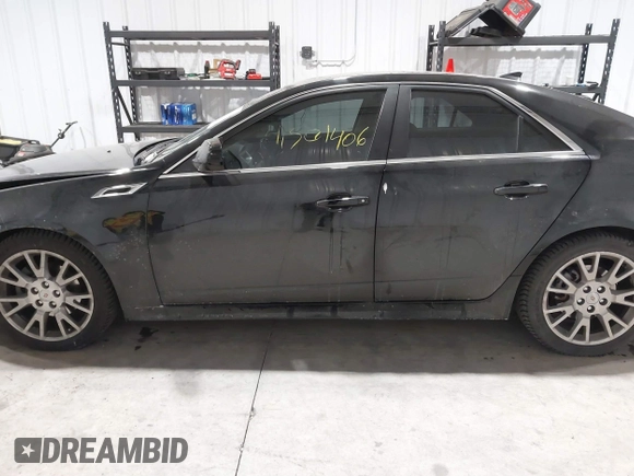 2013 Cadillac CTS Premium z VIN 1G6DS5E34D0103328, wystawiony jako IAAI lot #41501406 z przebiegiem 157 633 mil mil oraz . Historia ofert i sprzedaży dostępna na DreamBid. Obrazek 14.