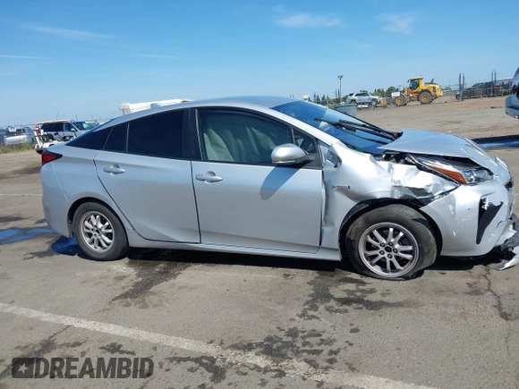 2021 Toyota Prius L Eco with VIN JTDKAMFUXM3144991, listed as a IAAI auction lot 42147025 with 106,466 mi miles and . Bid and sale history available at DreamBid. Image 12.