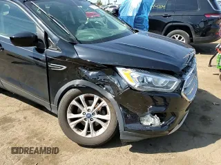 2017 Ford Escape SE z VIN 1FMCU0GD5HUD52467, wystawiony jako Copart lot #70616944 z przebiegiem 115 876 mil mil oraz Szkoda całkowita • Salvage title. Historia ofert i sprzedaży dostępna na DreamBid. Obrazek 11.