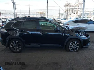 2023 Toyota Corolla Cross XLE with VIN 7MUDAAAG8PV072030, listed as a IAAI auction lot 42397573 with 6,584 mi miles and . Bid and sale history available at DreamBid. Image 12.