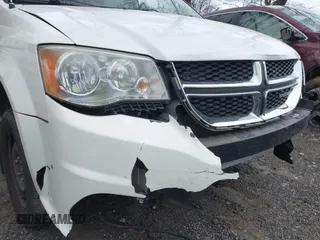 2012 Dodge Grand Caravan SE with VIN 2C4RDGBG9CR232038, listed as a IAAI auction lot 41823766 with 77,468 mi miles and . Bid and sale history available at DreamBid. Image 13.