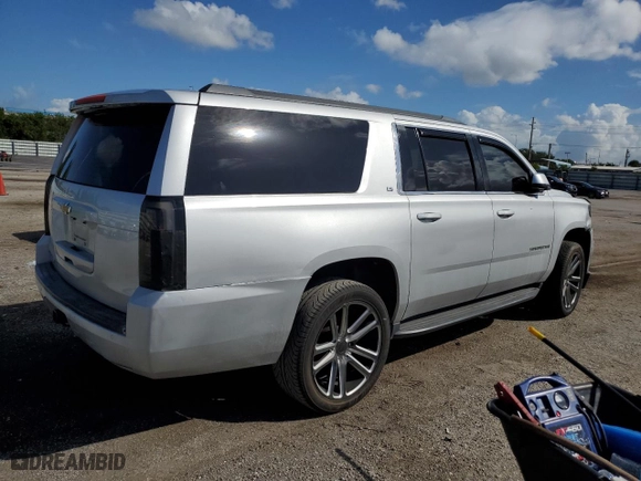 2015 Chevrolet Suburban LS with VIN 1GNSCHKC0FR142513, listed as a Copart auction lot 77311994 with 185,263 mi miles and Salvage Title. Bid and sale history available at carsss.com. Image 3.