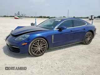 2022 Porsche Panamera с VIN WP0AJ2A78NL100992, выставлен на аукционе Copart как лот 57489505 с пробегом 10 474 миль миль и Списание • Salvage title. История ставок и продаж доступна на DreamBid. Изображение 1.