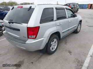 2007 Jeep Grand Cherokee Laredo with VIN 1J8GR48K47C687339, listed as a IAAI auction lot 41904034 with 158,661 mi miles. Bid and sale history available at carsss.com. Image 4.