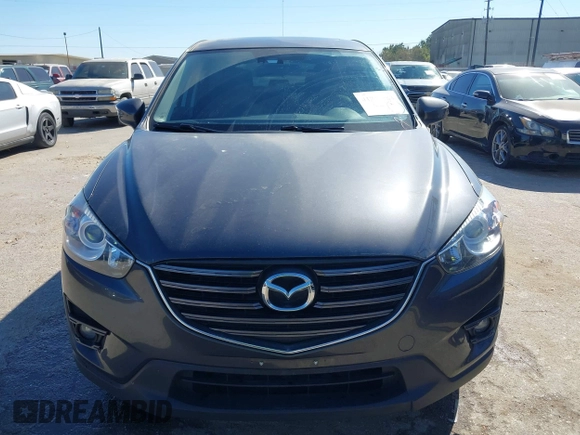 2016 Mazda CX-5 Grand Touring with VIN JM3KE2DYXG0784615, listed as a IAAI auction lot 41846853 with 72,185 mi miles. Bid and sale history available at carsss.com. Image 12.