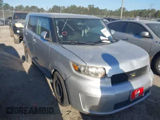 2009 Scion xB with VIN JTLKE50E991076881, listed as a IAAI auction lot 41842788 with 123,728 mi miles. Bid and sale history available at carsss.com. Image 1.
