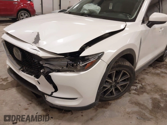 2018 Mazda CX-5 S Premium with VIN JM3KFBDM1J1412088, listed as a IAAI auction lot 41497431 with 65,532 mi miles and . Bid and sale history available at DreamBid. Image 6.