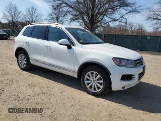 2012 Volkswagen Touareg Sport with VIN WVGEF9BP3CD011165, listed as a Copart auction lot 48913935 with 118,839 mi miles and Salvage Title. Bid and sale history available at DreamBid. Image 4.