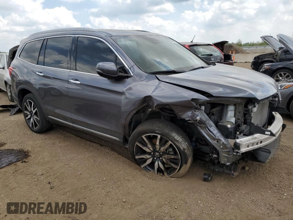 2022 Honda Pilot Touring 7-Passenger with VIN 5FNYF6H6XNB014347, listed as a Copart auction lot 56869745 with 31,513 mi miles and Salvage title. Bid and sale history available at DreamBid. Image 4.