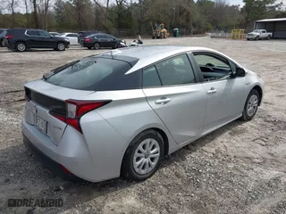 2021 Toyota Prius L Eco with VIN JTDKAMFU1M3152848, listed as a IAAI auction lot 41600212 with 140,114 mi miles. Bid and sale history available at carsss.com. Image 4.