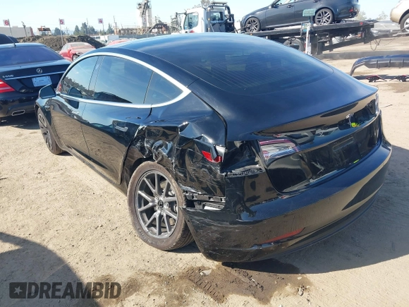 2018 Tesla Model 3 Long Range Battery with VIN 5YJ3E1EA0JF056979, listed as a IAAI auction lot 41865849 with 97,319 mi miles. Bid and sale history available at carsss.com. Image 3.