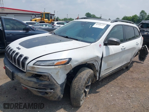 2017 Jeep Cherokee Trailhawk with VIN 1C4PJMBSXHW657446, listed as a IAAI auction lot 42406437 with 158,351 mi miles and . Bid and sale history available at DreamBid. Image 2.