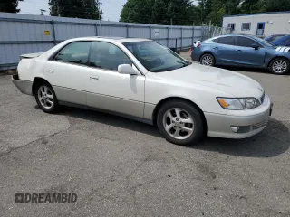 2000 Lexus ES 300 with VIN JT8BF28G6Y5099537, listed as a Copart auction lot 61873595 with 167,090 mi miles and Salvage title. Bid and sale history available at DreamBid. Image 4.