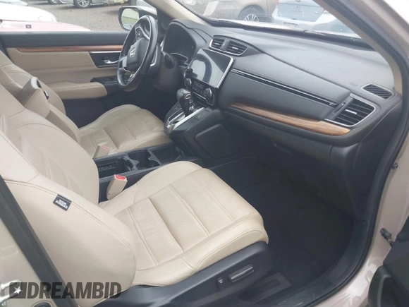 2018 Honda CR-V Touring with VIN 5J6RW2H96JL000910, listed as a IAAI auction lot 42490580 with 201,534 mi miles and . Bid and sale history available at DreamBid. Image 5.