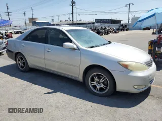 2004 Toyota Camry LE with VIN 4T1BE32K94U300544, listed as a Copart auction lot 60529005 with 223,940 mi miles and Clean title. Bid and sale history available at DreamBid. Image 4.