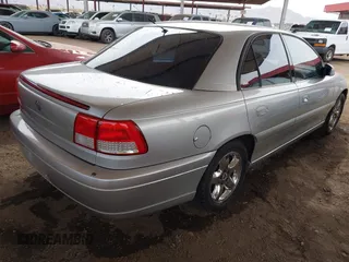 2001 Cadillac Catera z VIN W06VR54R51R058055, wystawiony jako IAAI lot #41574366 z przebiegiem 141 543 mil mil oraz . Historia ofert i sprzedaży dostępna na DreamBid. Obrazek 4.