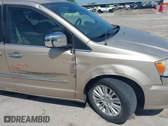 2013 Chrysler Town & Country Touring L with VIN 2C4RC1CG2DR767406, listed as a IAAI auction lot 42067814 with 75,985 mi miles and . Bid and sale history available at DreamBid. Image 6.