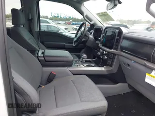 2024 Ford F-150 Lightning XLT with VIN 1FTVW3LKXRWG01185, listed as a IAAI auction lot 41679606 with 4,961 mi miles and . Bid and sale history available at DreamBid. Image 5.