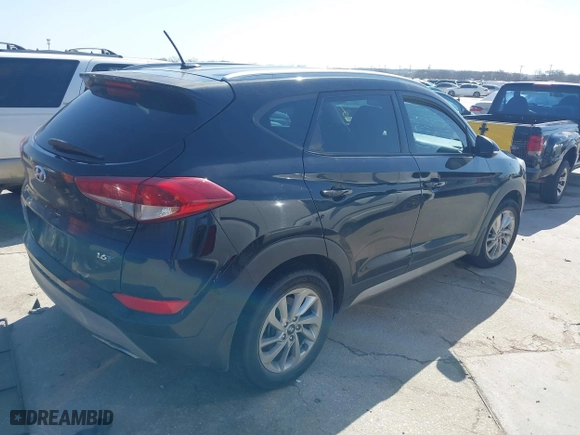 2017 Hyundai Tucson Value with VIN KM8J33A28HU302472, listed as a IAAI auction lot 41717598 with 126,438 mi miles. Bid and sale history available at carsss.com. Image 4.