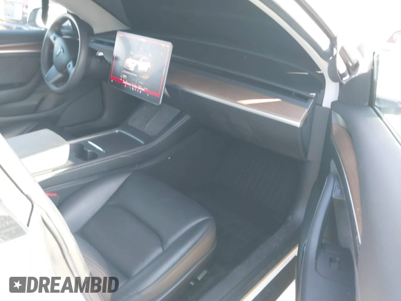 2023 Tesla Model 3 with VIN 5YJ3E1EA0PF503352, listed as a IAAI auction lot 41718658 with 28,426 mi miles and . Bid and sale history available at DreamBid. Image 5.
