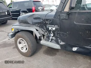 2002 Jeep Wrangler X with VIN 1J4FA39S92P774054, listed as a IAAI auction lot 41470351 with 209,727 mi miles. Bid and sale history available at carsss.com. Image 6.