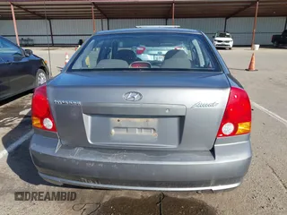 2004 Hyundai Accent GL with VIN KMHCG45C04U531177, listed as a IAAI auction lot 41526033 with 126,102 mi miles. Bid and sale history available at carsss.com. Image 16.
