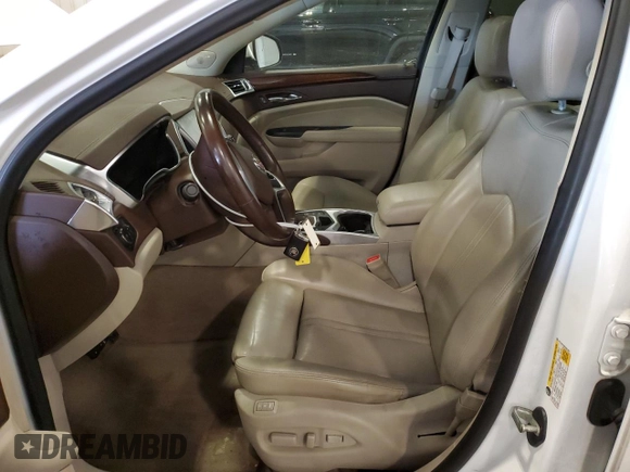 2014 Cadillac SRX Premium Collection z VIN 3GYFNGE36ES581361, wystawiony jako Copart lot #88540815 z przebiegiem 137 047 mil mil oraz Nie do naprawy. Historia ofert i sprzedaży dostępna na DreamBid. Obrazek 7.