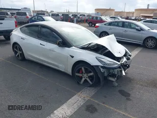 2019 Tesla Model 3 Mid Range with VIN 5YJ3E1EA6KF396946, listed as a IAAI auction lot 41123058 with 69,013 mi miles. Bid and sale history available at carsss.com. Image 1.