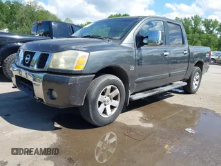 2004 Nissan Titan LE with VIN 1N6AA07B04N525607, listed as a IAAI auction lot 42180184 with 267,589 mi miles. Bid and sale history available at carsss.com. Image 2.