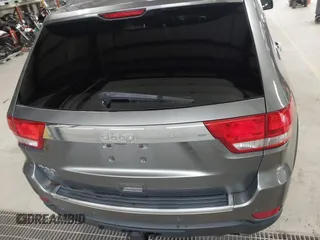2013 Jeep Grand Cherokee Overland with VIN 1C4RJFCT9DC524605, listed as a IAAI auction lot 42016103 with 215,352 mi miles. Bid and sale history available at carsss.com. Image 16.