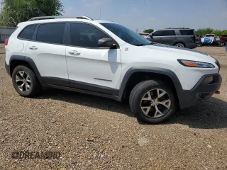 2014 Jeep Cherokee Trailhawk with VIN 1C4PJMBS9EW140344, listed as a Copart auction lot 50579005 with 117,326 mi miles and Salvage Title. Bid and sale history available at carsss.com. Image 4.