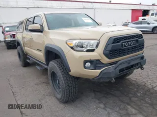 2016 Toyota Tacoma SR with VIN 3TMCZ5AN1GM018850, listed as a IAAI auction lot 41884584 with 65,634 mi miles. Bid and sale history available at carsss.com. Image 1.