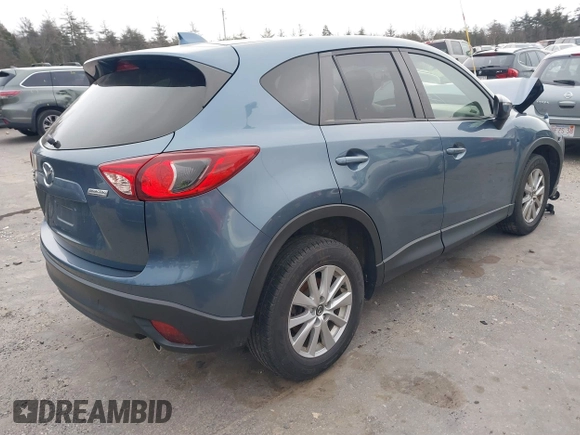 2015 Mazda CX-5 Touring with VIN JM3KE4CY1F0545305, listed as a IAAI auction lot 41234599 with 92,791 mi miles. Bid and sale history available at carsss.com. Image 4.