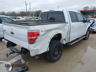 2011 Ford F-150 XLT with VIN 1FTFW1ET0BFD21778, listed as a IAAI auction lot 41382137 with 164,722 mi miles and . Bid and sale history available at DreamBid. Image 4.