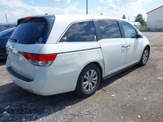 2014 Honda Odyssey EX-L with VIN 5FNRL5H69EB048867, listed as a IAAI auction lot 42190464 with 172,487 mi miles and . Bid and sale history available at carsss.com. Image 4.